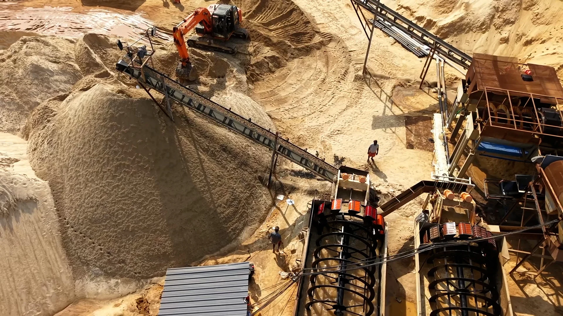 Hydraulic dredging machinery extracting river sand from licensed dam reservoir in Trivandrum Kerala